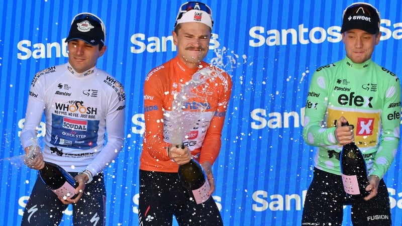 Australia's Jay Vine (C) celebrates winning the Tour Down Under