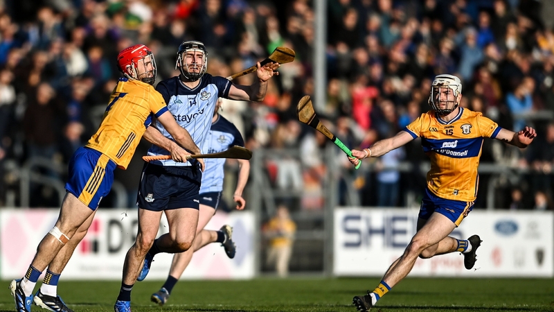 25 January 2026; Ronan Hayes of Dublin is tackled by Darragh Lohan of Clare during the Allianz Hurling League Division 1B match between Clare and Dublin at Zimmer Biomet Páirc Chíosóg in Ennis, Clare. Photo by Tom Beary/Sportsfile