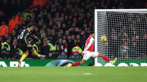Matheus Cunha of Manchester United scores his team's third goal during the Premier League match between Arsenal and Manchester United at Emirates Stadium on January 25, 2026 in London, England.