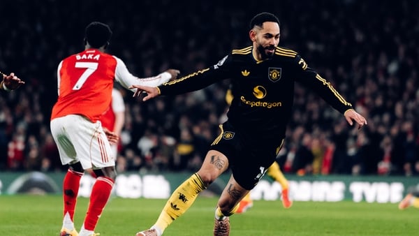 Matheus Cunha of Manchester United celebrates scoring their third goal during the Premier League match between Arsenal and Manchester United at Emirates Stadium on January 25, 2026 in London, England.
