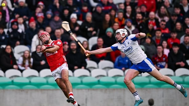 William Buckley of Cork scores a point despite the attention of Shane Bennett of Waterford - 2026 Allianz HL