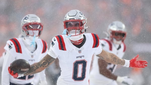 Christian Gonzalez #0 of the New England Patriots celebrates with teammates after intercepting a pass from Jarrett Stidham #8 of the Denver Broncos (not pictured) intended for Marvin Mims Jr. #19 (not pictured) during the fourth quarter in the AFC Champio