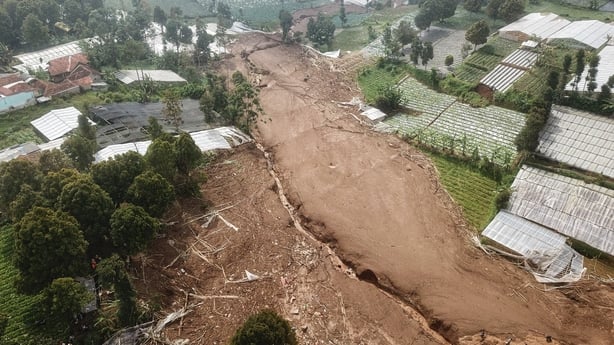 An aerial view shows part of Pasirlangu village after a landslide in Bandung Regency