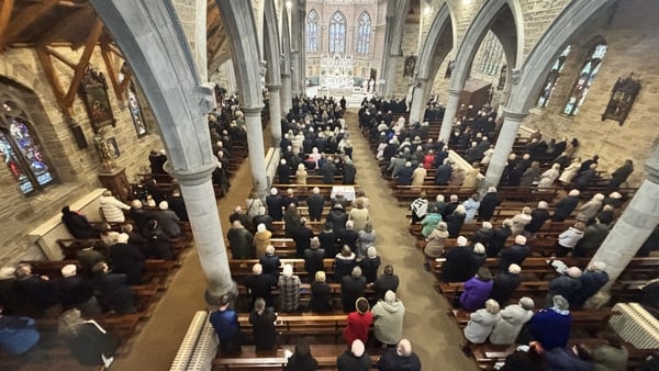 A view from the balcony inside the church for funeral of Brian Crowley down on mourners