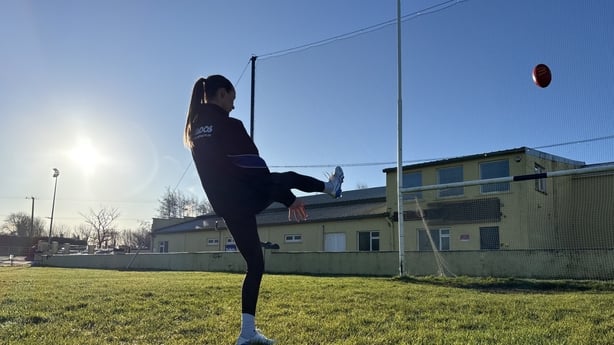 Amy Gavin Mangan kicks a ball over the bar at her local GAA pitch