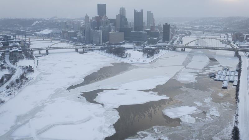 The ice-covered Allegheny River and Monongahela River meet to form the Ohio River in Pittsburgh, Pennsylvania, US, on Monday, Jan. 26, 2026. US power grids are expected to grapple with unprecedented seasonal demand and the threat of blackouts after a dama