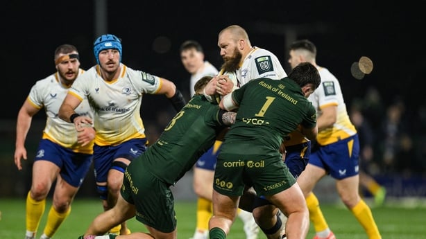 RG Snyman of Leinster is tackled by Sean Jansen amd Billy Bohan of Connacht during the United Rugby Championship match between Connacht and Leinster at Dexcom Stadium in Galway.