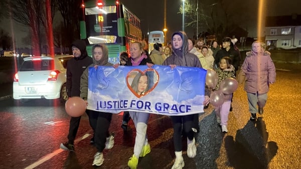 Members of the public join Siobhan Lynch, the mother of a teenage girl who died after a scrambler crash in north Dublin, take part in a walk