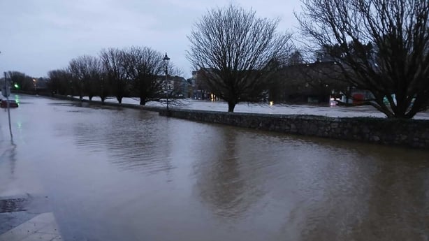 a flooded road in enniscorthy during a storm