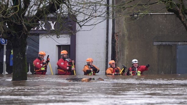 People in flood waters in Enniscorthy 