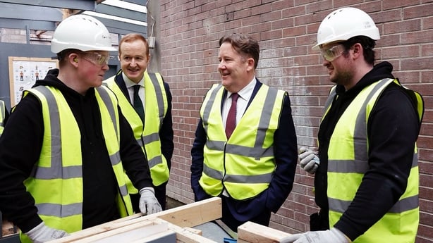 Minister Darragh O'Brien and SEAI CEO William Walsh meeting retrofitting students at St Andrew's Construction Skills Training Centre in Dublin