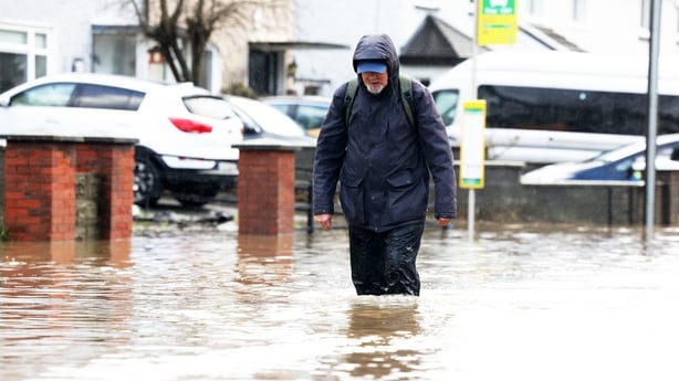 A man walks through flooded streets in Dublin 