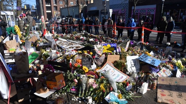 People gather at a makeshift memorial in Minneapolis 