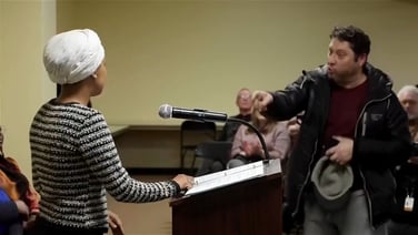 Moment Minnesota Representative Ilhan Omar is attacked at town hall
