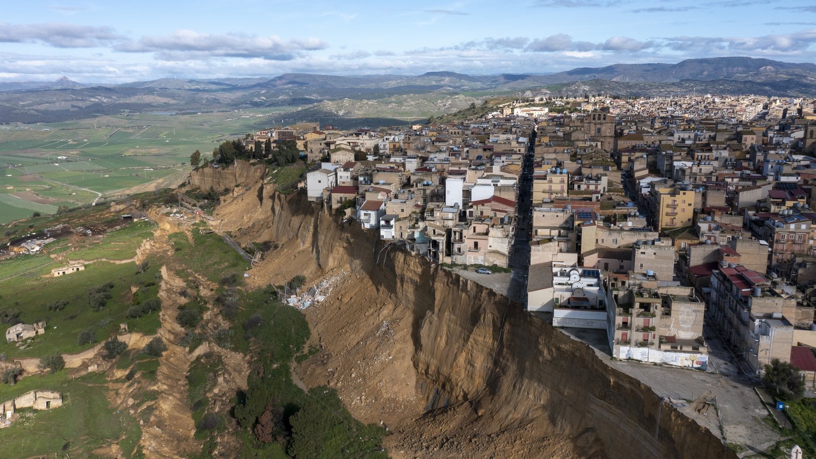 Landslide leaves Sicilian town on cliff edge after storms