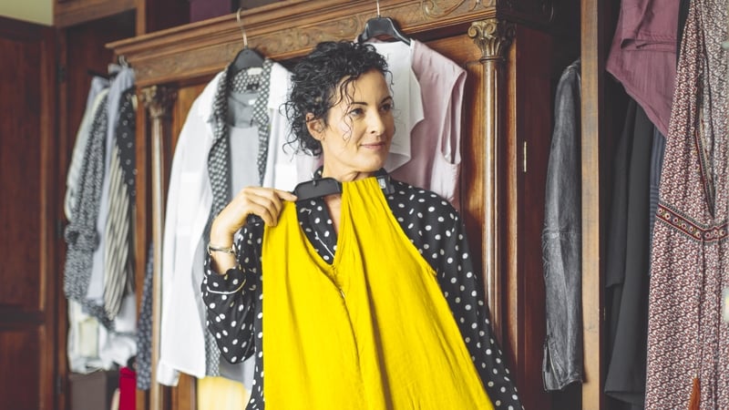 Woman is choosing the right dress to wear