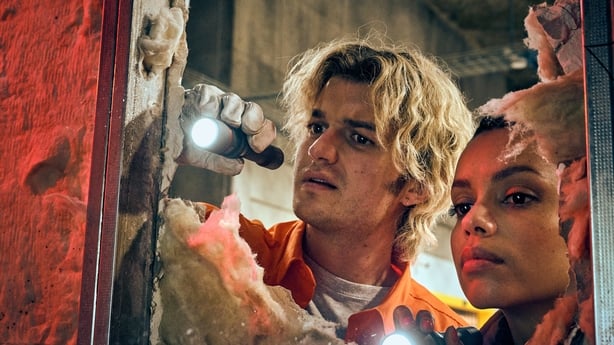 Joe Keery as Travis and Georgina Campbell as Naomi investigate in Cold Storage