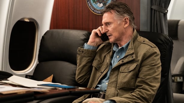 Liam Neeson as Robert Quinn on the phone in Cold Storage