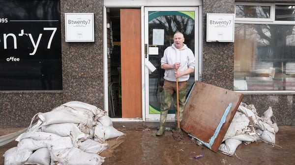 A shop owner cleans out his shop
