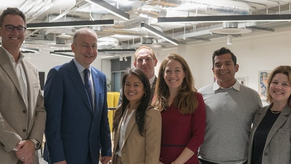 Group of business people pictured in an office with Taoiseach Micheál Martin