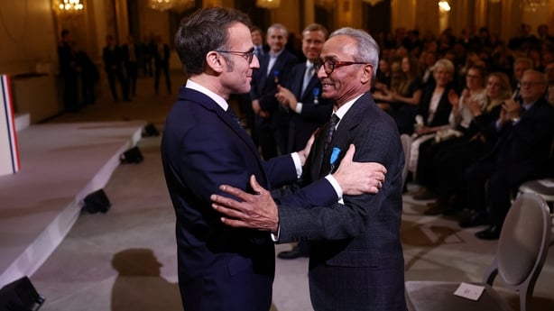 Macron with Akbar