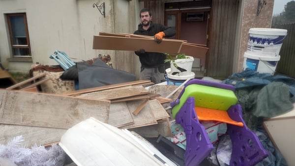 Residents in Riverfield in Aughrim, County Wicklow, during the clean up after Storm Chandra