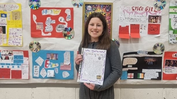 Isabelle Sheila Caulfield standing with her letter.