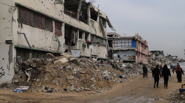 A view of a collapsed building as civilians who lost their homes struggle with harsh weather conditions in Gaza