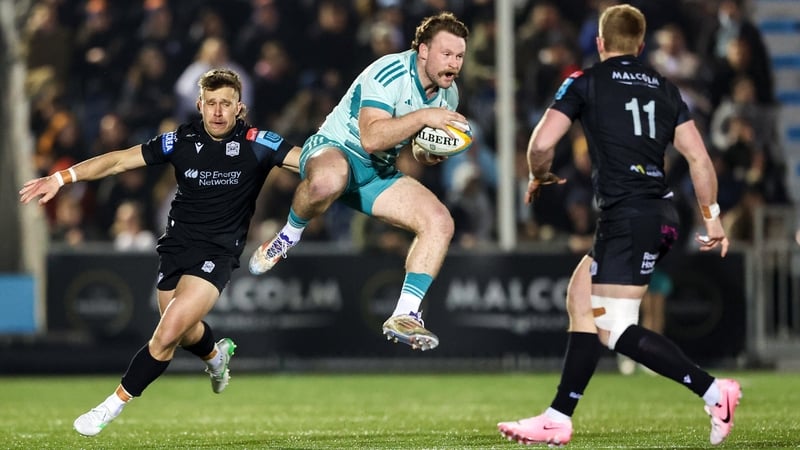 21 March 2025; Sean O'Brien of Munster in action against Kyle Rowe of Glasgow Warriors during the United Rugby Championship match between Glasgow Warriors and Munster at Scotstoun Stadium in Glasgow, Scotland. Photo by Ewan Bootman/Sportsfile