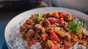 Chilli con carne - Delicious with baked potatoes, warm pitta breads show image