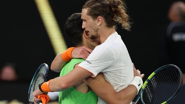 Spain's Carlos Alcaraz (L) embraces Germany's Alexander Zverev