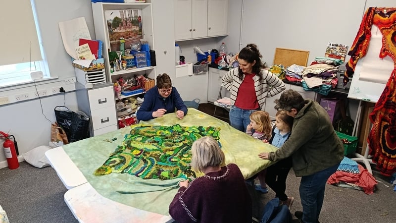 People working on the tapestry at the Athlone Family Resource Centre