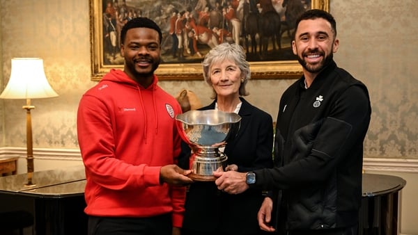 The President of Ireland Catherine Connolly receives FAI President's Cup representatives Derry City's Dipo Akinyemi and Shamrock Rovers captain Roberto Lopes, right, at Áras an Uachtaráin in Dublin. On Saturday 31st January, last season’s SSE Airtricity M