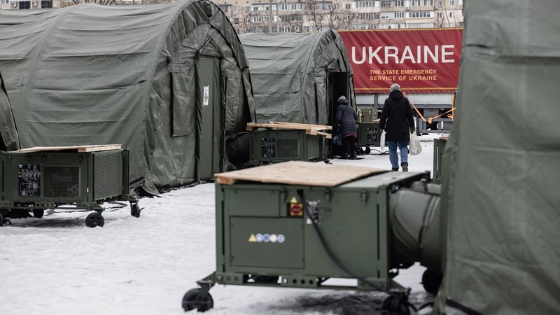 Residents visit emergency tents in the Troieshchyna district to warm themselves and receive hot meal in Kyiv, Ukraine