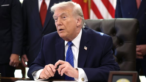 US President Donald Trump delivers remarks before signing an executive order in the Oval Office of the White House on January 30, 2026