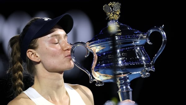 MELBOURNE, AUSTRALIA - JANUARY 31: Elena Rybakina of Kazakhstan kisses the Daphne Akhurst Memorial Cup after her victory in the Women's Singles Final against Aryna Sabalenka during day 14 of the 2026 Australian Open at Melbourne Park on January 31, 2026 i