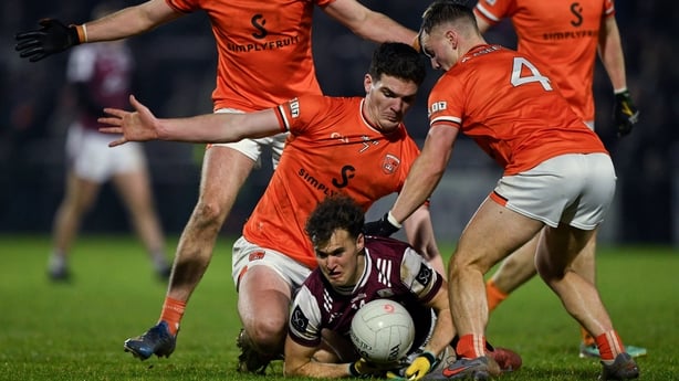 31 January 2026; Robbert Finnerty of Galway is tackled by Peter McGrane, 4, amf Jarly Óg Burns of Armagh during the Allianz Football League Division 1 match between Armagh and Galway at BOX-IT Athletic Grounds, Armagh. Photo by Ray McManus/Sportsfile