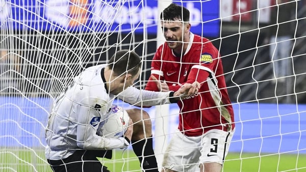 Darko Nejasmic of NEC Nijmegen and Troy Parrott of AZ fight for the ball after AZ scored 1-2 during the Dutch Eredivisie match between AZ Alkmaar and NEC at the AFAS Stadium on January 31, 2026, in Alkmaar, Netherlands.