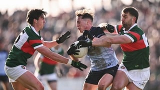 1 February 2026; Conor Tyrrell of Dublin is tackled by Aidan O'Shea, righrt, and Sam Callinan of Mayo during the Allianz Football League Division 1 match between Mayo and Dublin at the Hastings Insurance MacHale Park in Castlebar, Mayo. Photo by Ben McSha