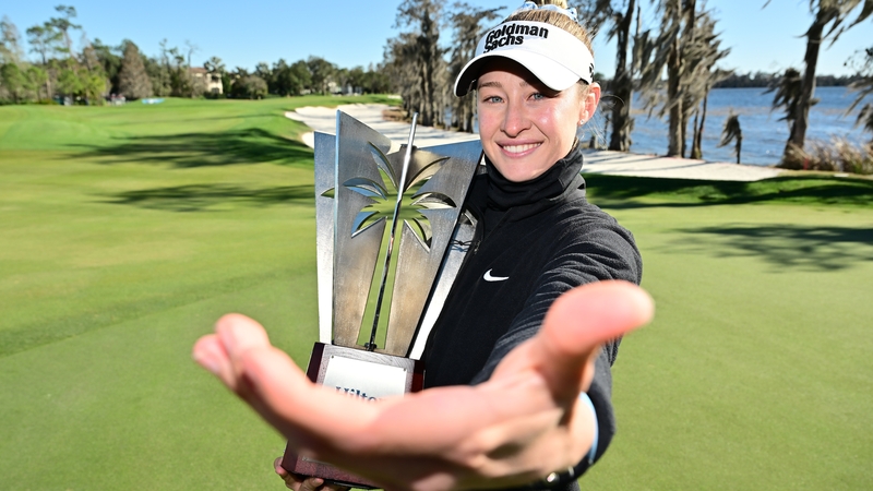 Nelly Korda of the United States imitates a selfie with the trophy following the completion of the third round of the Hilton Grand Vacations Tournament of Champions 2026 at Lake Nona Golf & Country Club on February 1, 2026 in Orlando, Florida. The tournam