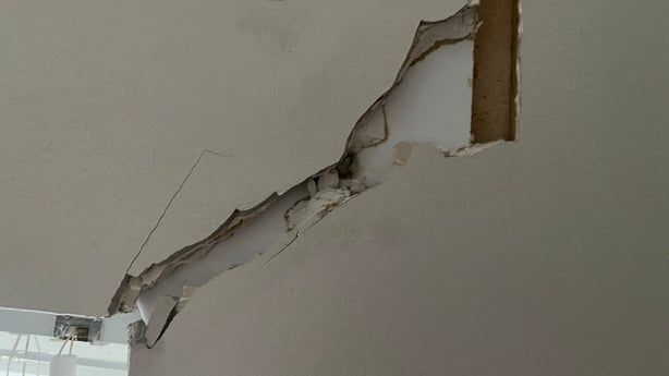 A large crack in the internal wall of a house