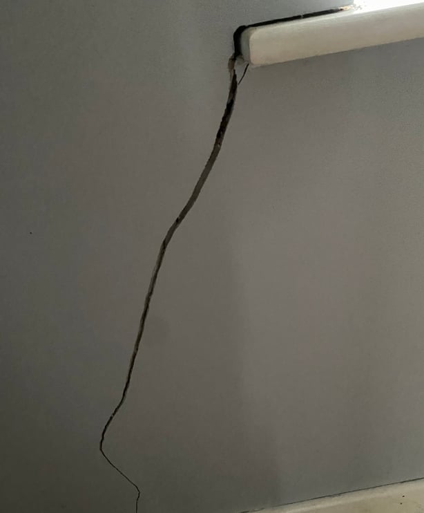 large crack beneath a window sill in a house