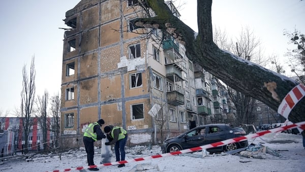 KYIV, UKRAINE - FEBRUARY 3: Police officers collect UAV's fragments found at the site of a Russian drone strike on the city residential area on February 3, 2026 in Kyiv, Ukraine. Amid plunging temperatures in Ukraine to -20 °C, Russia resumed strikes on t
