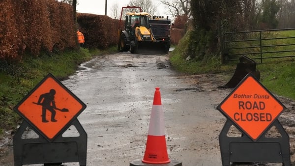 Wicklow county council workers fill in a subsided stretch of road at Killalongford on the Carlow-Wicklow border as Ireland experiences another bout of heavy rainfall. Tuesday February 3, 2026.
