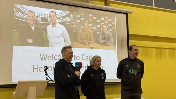 Republic of Ireland football managers Heimir Halgrimsson, Carla Ward and John O'Shea on stage at Carrigtwohill Community National School