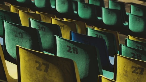 Empty plastic stadium seats in a row