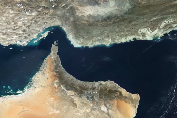 STRAIT OF HORMUZ - 2 OCTOBER 2024: Satellite view of the Strait of Hormuz, a critical chokepoint for global energy supply, connecting the Persian Gulf to the Gulf of Oman. This vital maritime route facilitates the transportation of goods, including oil and natural gas, between the Middle East and th