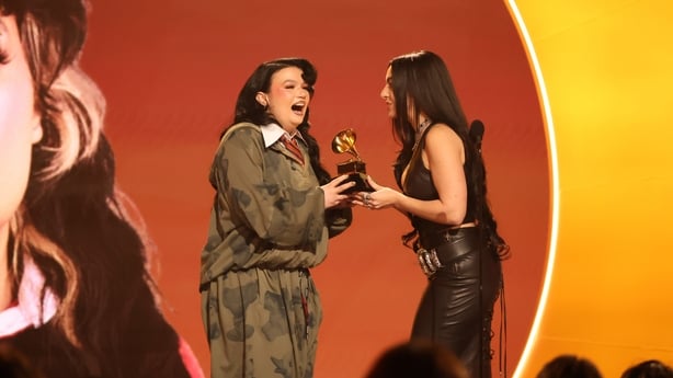 LOS ANGELES, CALIFORNIA - FEBRUARY 01: (L-R) Lola Young accepts the award for Best Pop Solo Performance for "Messy" from Charli xcx during the 68th GRAMMY Awards at Crypto.com Arena on February 01, 2026 in Los Angeles, California. (Photo by Johnny Nunez/Getty Images for The Recording Academy)
