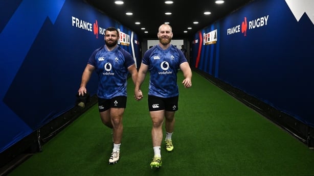4 February 2026; Michael Milne, left, and Jeremy Loughman make their way onto the pitch before the Ireland rugby squad captain's run at Stade de France in Paris, France. Photo by Brendan Moran/Sportsfile