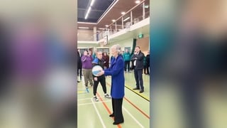 President Connolly scores with a no-look shot as she shoots hoops in Belfast